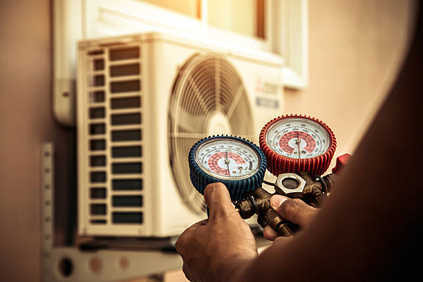 Professional Heat Pump Repair technician working in Lexington, TX